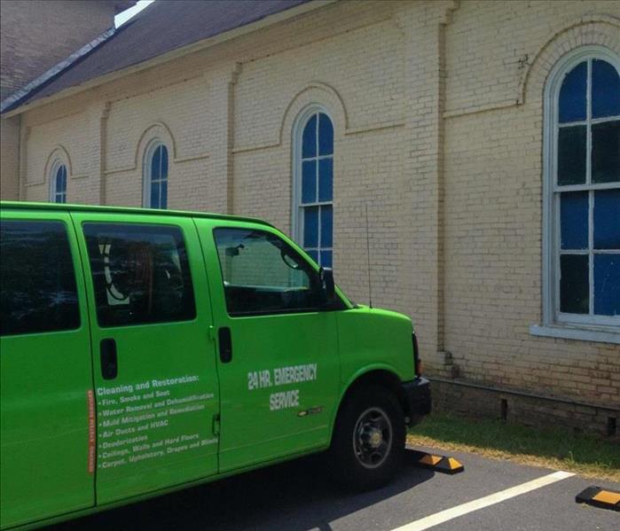 SERVPRO truck parked in front of a Woodstock, GA business.