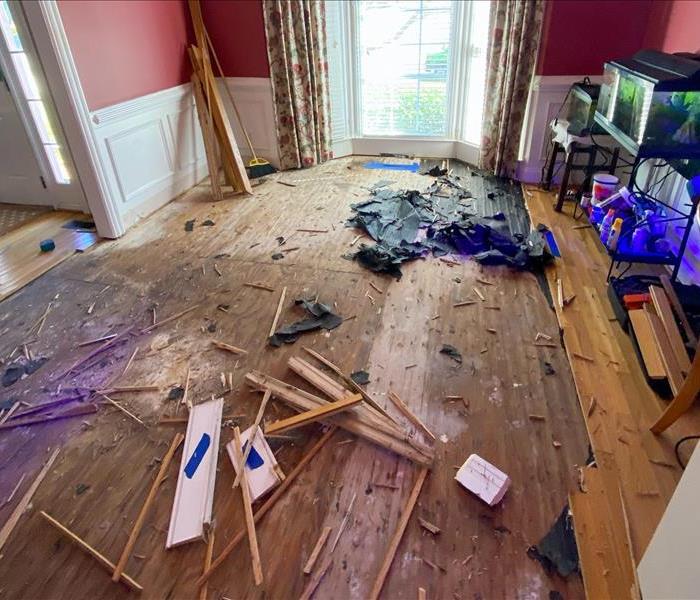 Damaged floors and walls in a Free Home, GA home after a flood